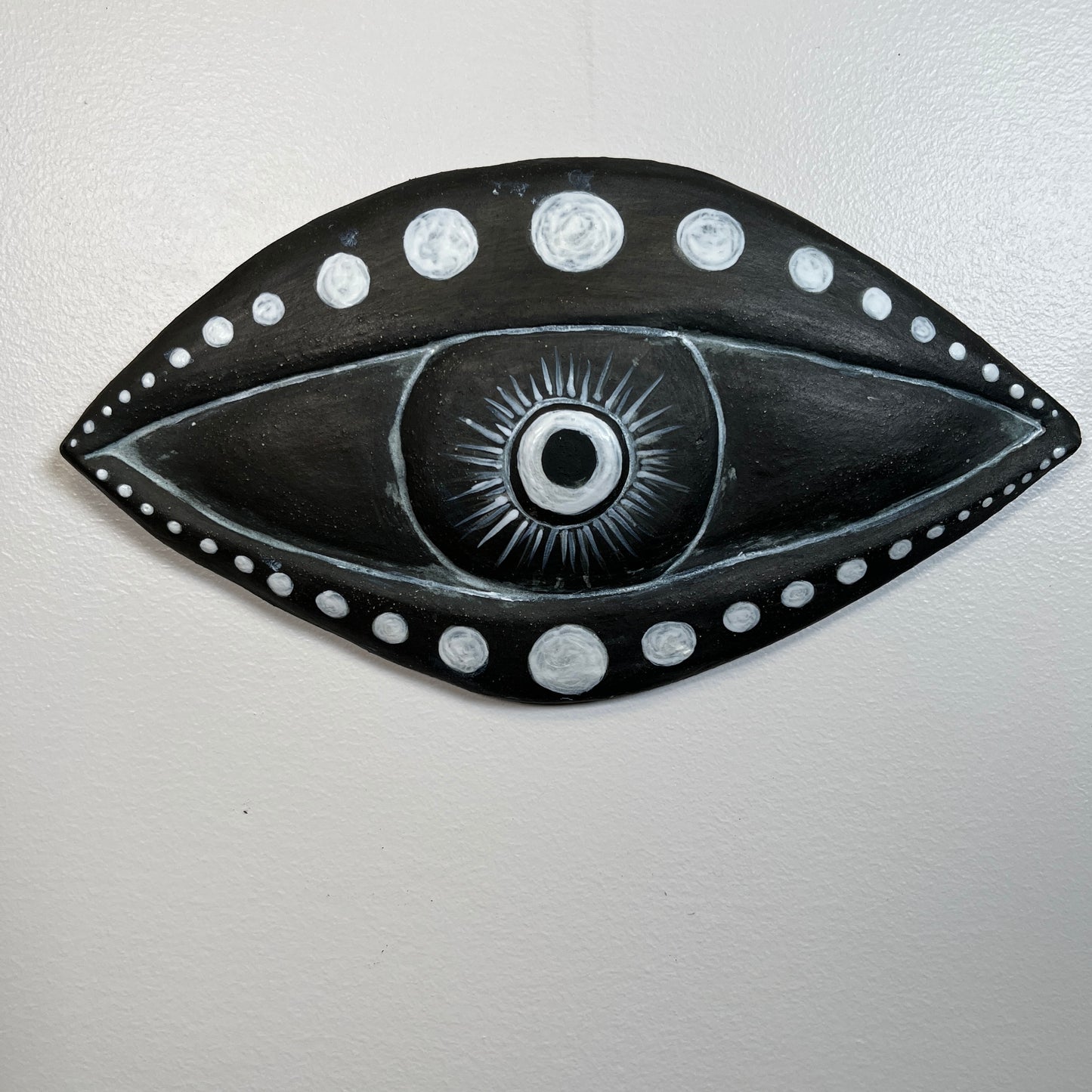 Ceramic eye black moon phase wall art artist made sculpture